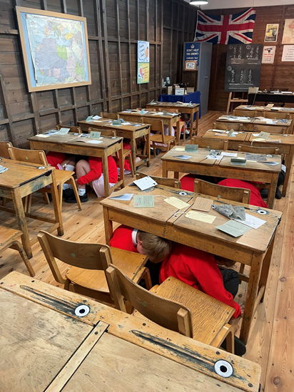 Year 6 hiding under desks in wartime classroom