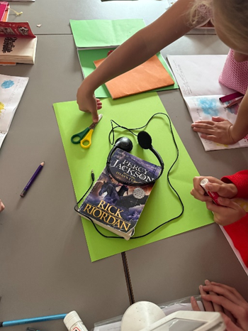 Children exploring with placing objects on card to create interesting compositions. 