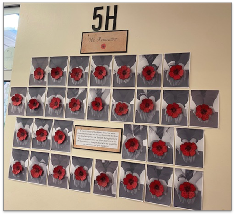 5H's Remembrance display board - photos of childrens' hand holding poppies