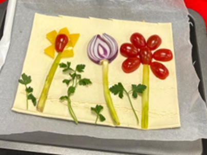 A trio of flowers made using vegetables 