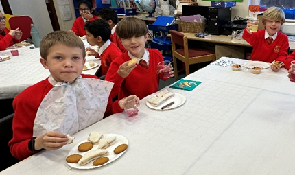 Children enjoying their sandwiches