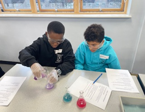 Year 6 children doing science experiments.