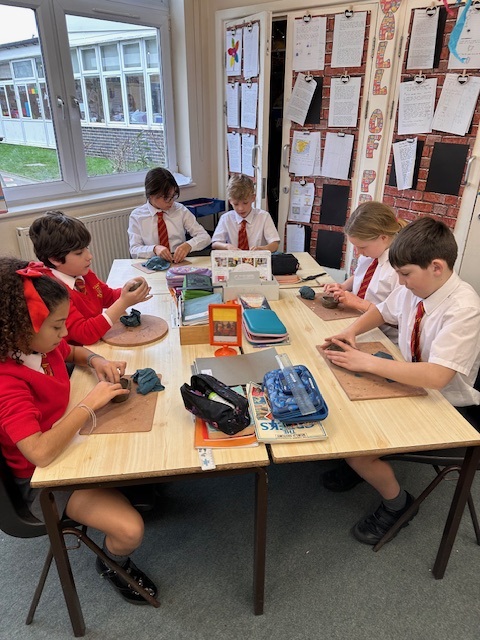 Year 5 making Greek pots using clay.