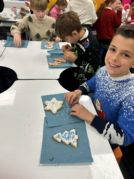 Year 6 decorating their biscuits