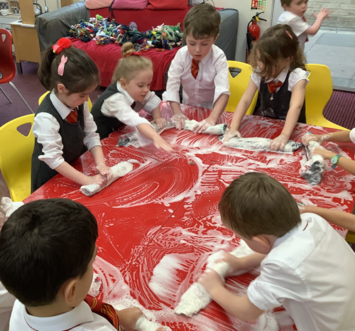 Next, we added water and soap and rolled to bind the wool together.