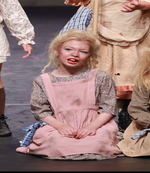 Young girl in flower dress in dance competition