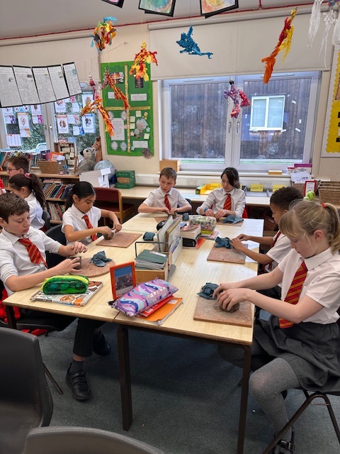 Year 5 making Greek pots using clay.