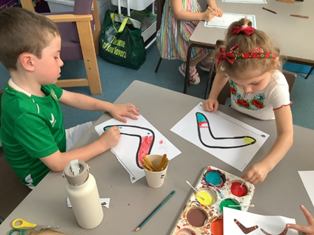 Children decorating their own boomerangs.