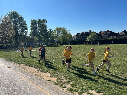 Year 6 pupils running a mini marathon.