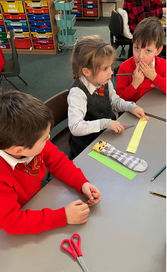 Children measuring a sock