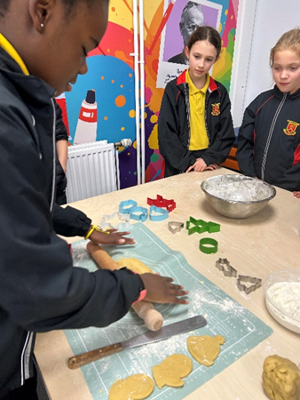 Year 6 children making biscuits