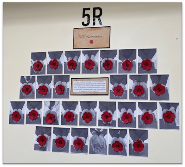 5R's Poppy display board - photos of childrens' outstretched hands holding poppies