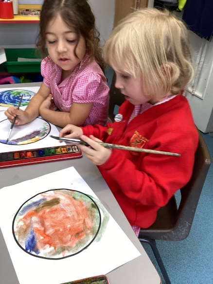 Recepeption child Painting Planets.