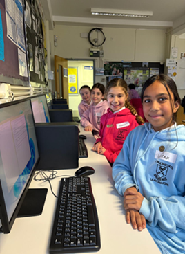 Year 6 children on the computers.