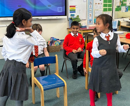 Black History Month - Y2 children re-enacting Rosa Parks' famous bus protest