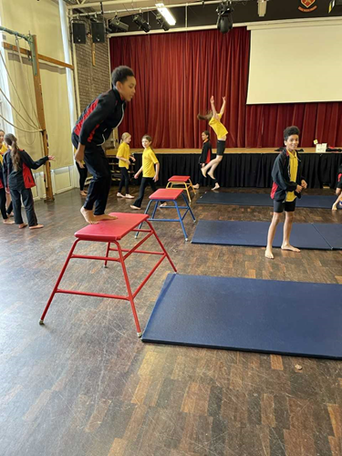 Year 6 using PE apparatus.