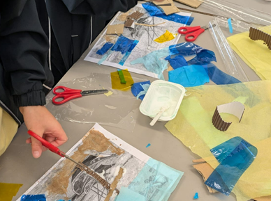 Reusing cardboard to create boats.