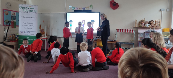 Year 4 children discussing scenario's in their anti bullying workshop.