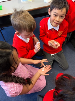 Children holding their Turkish Delight ready to taste it.  