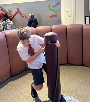 A boy spinning, using his bodyweight to move faster
