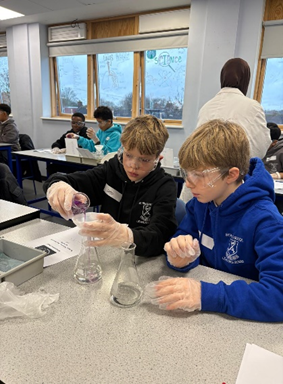 Year 6 children doing science experiments.