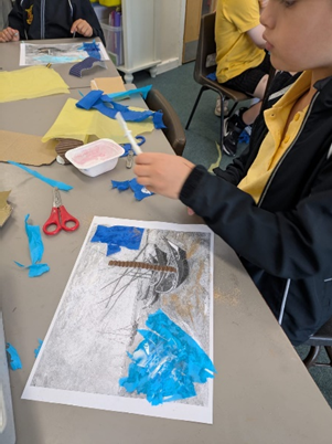 Layering tissue paper.