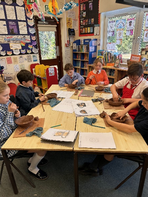 Year 5 making Greek Pots using clay.