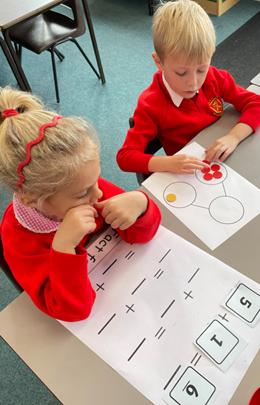 Year 1 children using part whole models to build fact families.