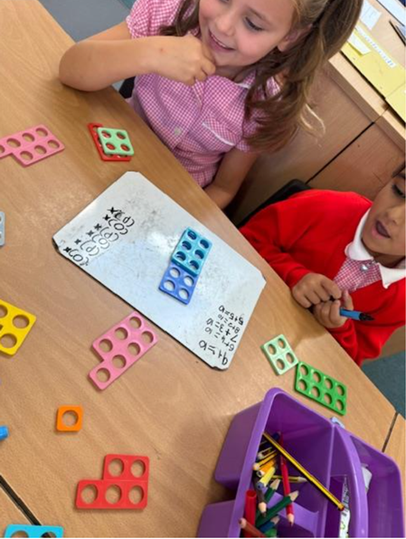 Year 2 exploring number bonds using Numicon