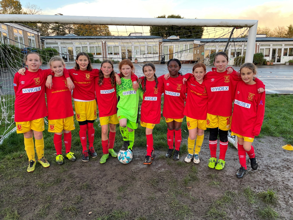 Photograph of our girls' football team on our school field