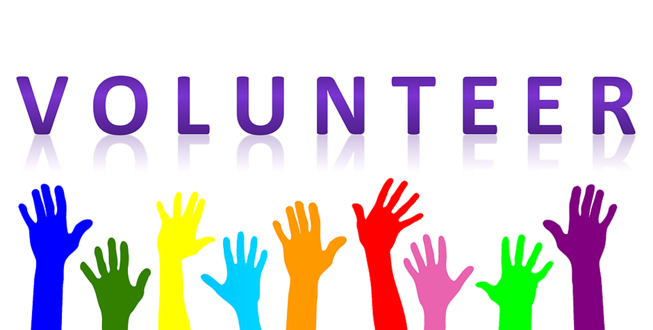 Image of hands reaching up to the word "Volunteer"