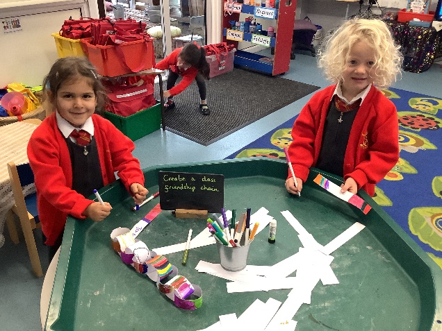 Reception making a class friendship chain and joined all the links together.