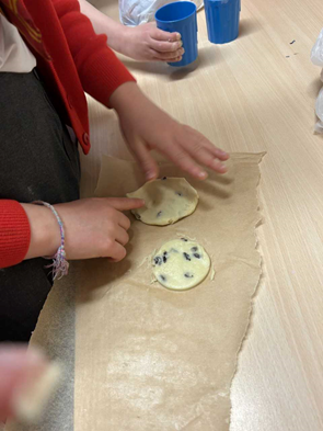 Unbaked biscuits on baking paper