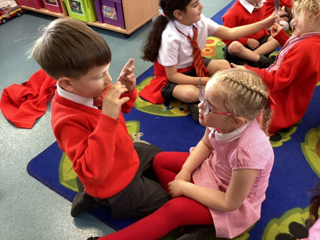 Looking at our faces and comparing to our partner to find similarities and differences between up 