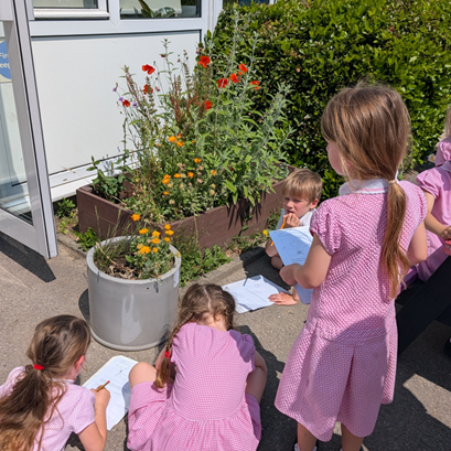 Children drawing flowers