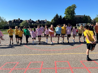 Year 6 warming up for their mini marathon.