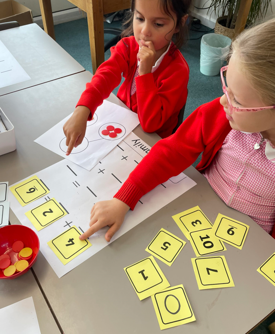 Year 1 children using part whole models to build fact families.