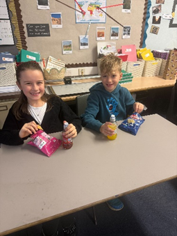 Children enjoying their party snacks and drinks. 