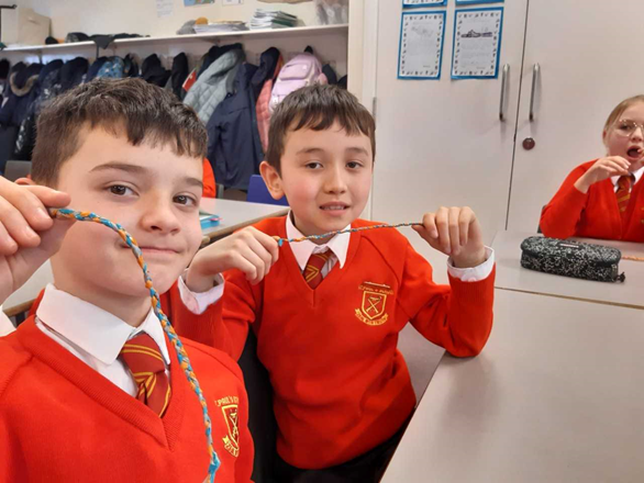 Year 4 boys making their friendship bracelets