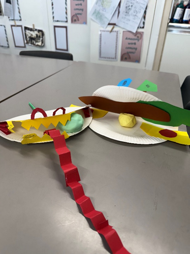Two of 3M’s pneumatic toys. One decorated like a snake with a long red paper tongue. 