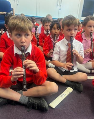 Children practising the tune ‘A is for Annie’ and demonstrating their positioning. 