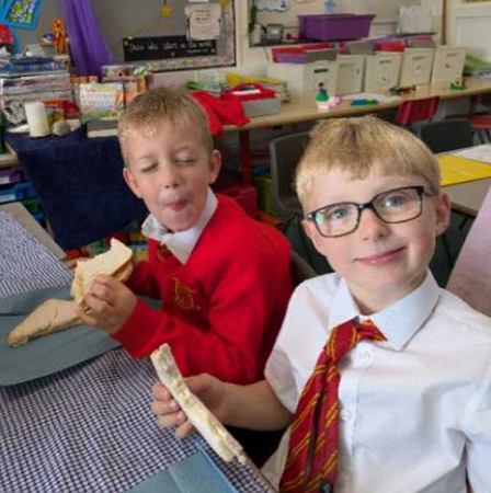 Year 1 enjoying their jam sandwiches