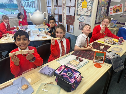 Children enjoying their afternoon tea sandwiches.