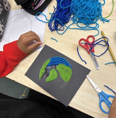 A child has made an image of the earth