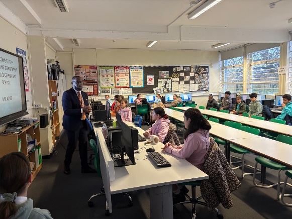Children doing a computing workshop.
