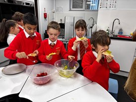 Children test the ingredients for quesadillas.