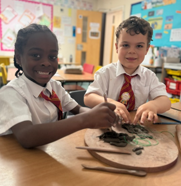 Year 2 creating and exploring with clay.