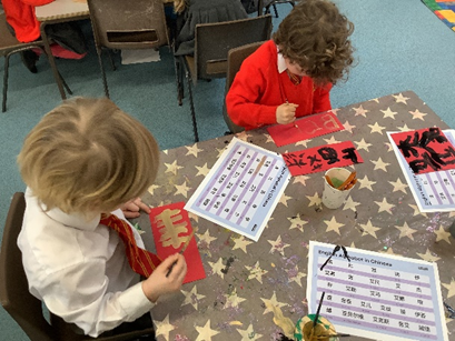 We wrote Chinese letters in black and gold paint.