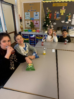 Children enjoying their party snacks and drinks. 