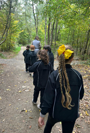Pictures of Year 3 practising how to be hunter-gatherers in the forest — exploring nature, learning survival skills, and discovering how the Celts lived off the land.